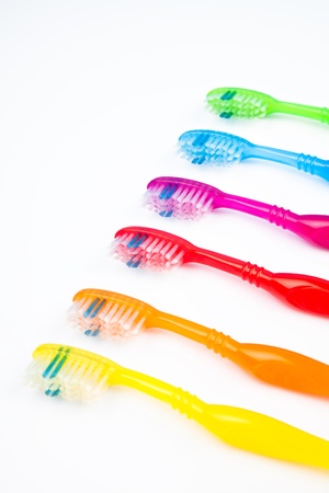 Six colorful toothbrushes in a lineの写真素材