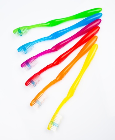 Six colorful toothbrushes in a lineの写真素材