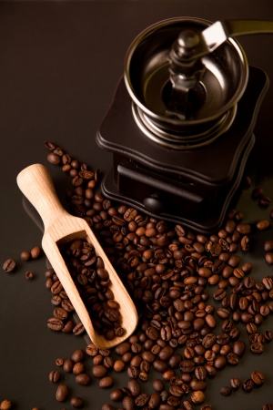 coffee beans, wooden scoop and old coffee millの写真素材