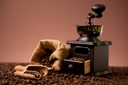 Coffee beans and old coffee millの写真素材