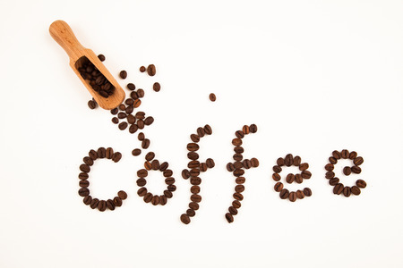 coffee sign made of coffee beans on white backgroundの写真素材