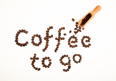 coffee sign made of coffee beans on white backgroundの写真素材