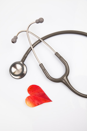 Stetoscope with a heart shaped leafの写真素材