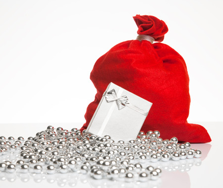 Red sack of presents and a gift box の写真素材