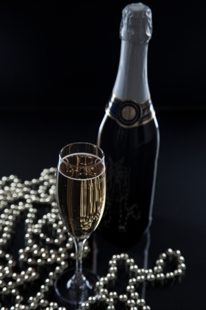 glass and a bottle of champagneの写真素材