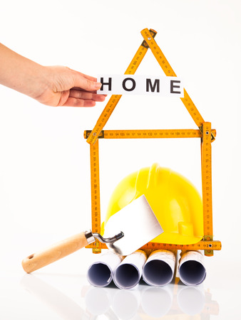 architectural project  yellow hardhat and measure の写真素材