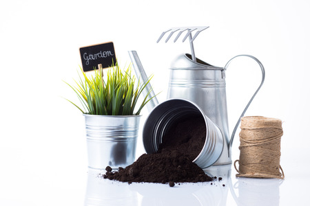 Subtle metal gardening items, plant and cord composition isolated on whiteの写真素材