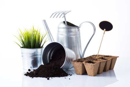 Subtle metal gardening items, plant composition isolated on whiteの写真素材