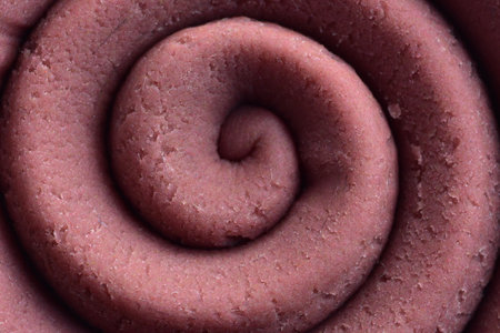 play dough modeling clay rolled into spiral close up top detailed view texture background color