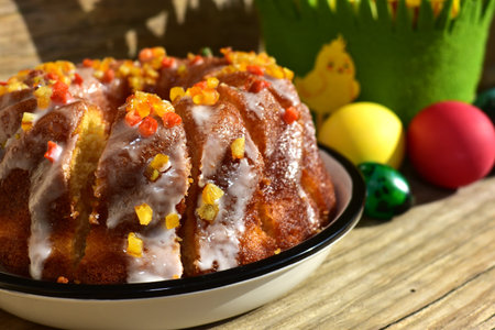 Traditional easter holidays baked pie and colorful eggs in the background. Chopped easter cake with...