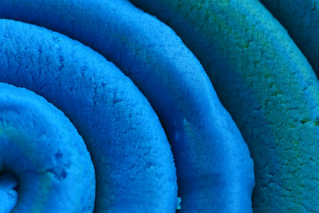 play dough modeling clay rolled into spiral close up top detailed view texture background. Associative image.の写真素材