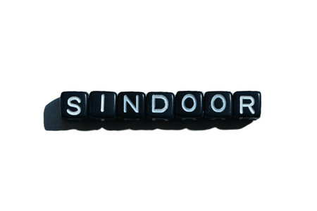 Sindoor spelled with black beads on isolated background. Cultural symbol of Hindu marriage; also evokes identity, gender debates, and IndiaâPakistan socio-religious tensions.の写真素材