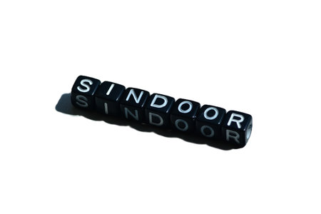 Sindoor spelled with black beads on isolated background. Cultural symbol of Hindu marriage; also evokes identity, gender debates, and IndiaâPakistan socio-religious tensions.の写真素材