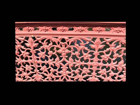 red flowers cast iron on bridge railingの写真素材