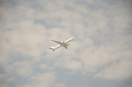 BANGKOK, THAILAND - February 5, 2017 : Passenger air plane flying on blue sky white clouds backgroundのeditorial素材
