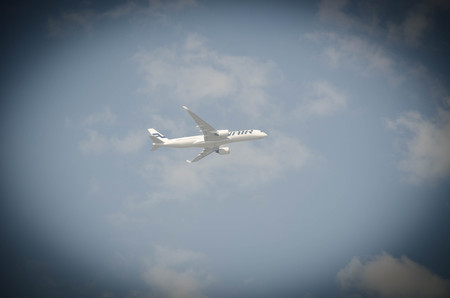 BANGKOK, THAILAND - February 5, 2017 : Passenger air plane flying on blue sky white clouds...