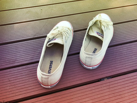 PATHUM THANI, THAILAND - MARCH 30 2017 ;converse all star shoes on the  bridge  at Thammasat University Rangsitのeditorial素材