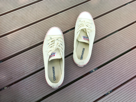 PATHUM THANI, THAILAND - MARCH 30 2017 ;converse all star shoes on the  bridge  at Thammasat University Rangsitのeditorial素材