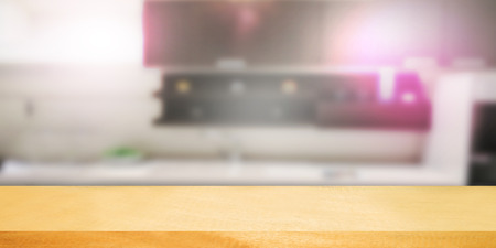 Empty wooden table and blurred kitchen background.can be used for montage or display your products.の写真素材