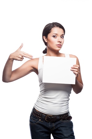 female in casual outfit holding and pointing on signの写真素材