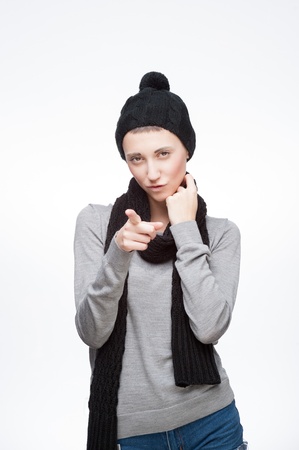 young girl pointing at camera with sexy lookの写真素材