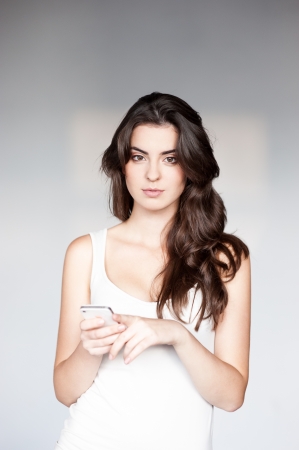 young casual caucasian girl with cell phoneの写真素材