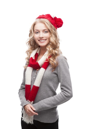 young blond smiling casual woman in red scarf and hatの写真素材
