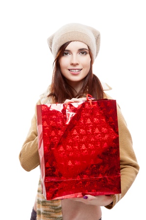 young smiling casual causasian brunette woman holding shopping bag  isolated on whiteの写真素材