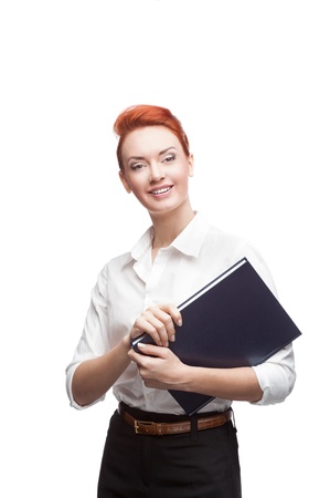 young red-haired caucasian smiling business woman holding diary isolated on whiteの写真素材