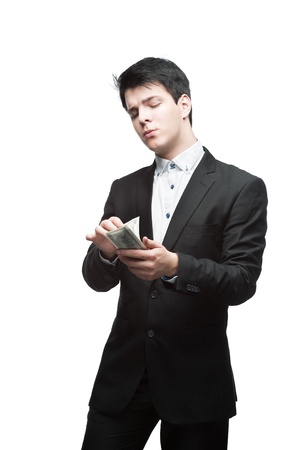 young funny caucasian brunette business man holding counting moneyの写真素材
