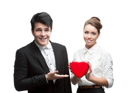 young caucasian brunette business people holding red Valentine and happy smiling at cameraの写真素材