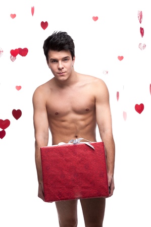 young sexy caucasian  man holding christmas gift isolated on white background with falling red heartsの写真素材