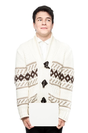 young funny caucasian brunette man in winter clothing holding sign isolated on whiteの写真素材
