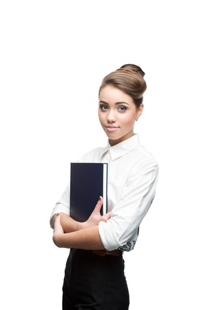young smiling business woman holding blue diary isolated on whiteの写真素材