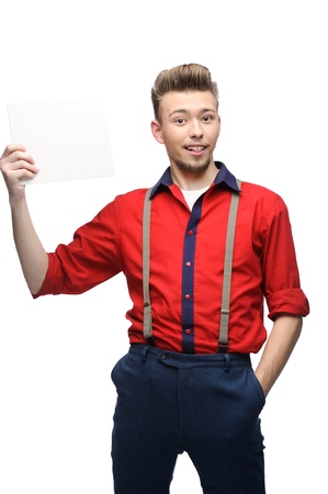 cheerful young caucasian man in red vintage clothing holding sign isolated on whiteの写真素材