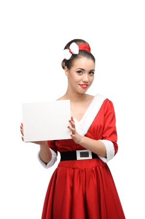 young cheerful retro girl in red vintage dress holding sign isolated on whiteの写真素材