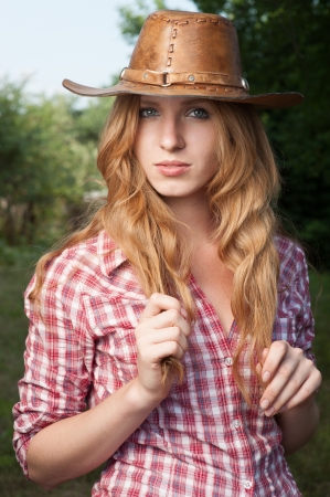 outdoors portrait of beautiful red haired  caucasian young womanの写真素材