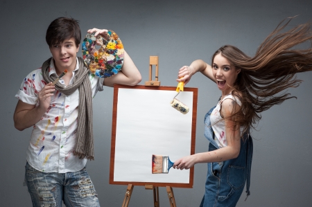 man and woman painters emotionally discussing art projectの写真素材