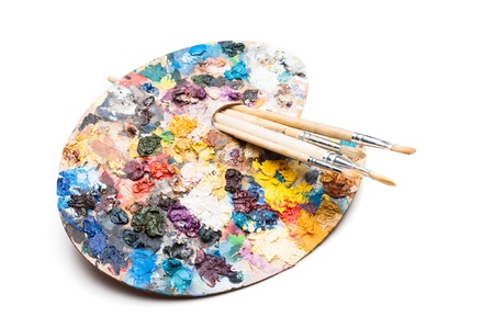 palette and brushes isolated on whiteの写真素材