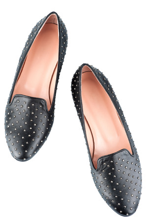 pair of black leather female shoes. isolated on whiteの写真素材