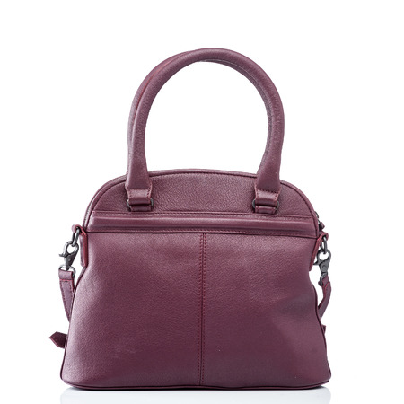 female red leather handbag isolated on whiteの写真素材