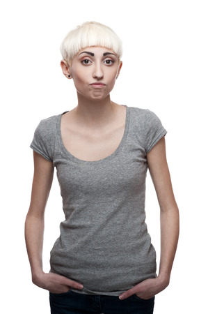 attractive casual young woman in gray t-shirt isolated on whiteの写真素材