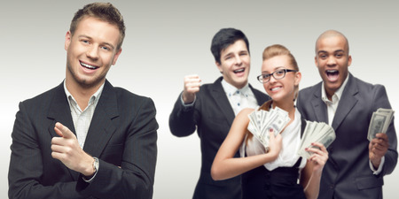 team of young successful business people standing over gray backgroundの写真素材