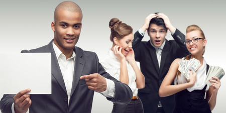 team of young successful business people standing over gray backgroundの写真素材