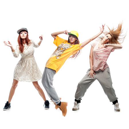 group of young female hip hop dancers isolated on white backgroundの写真素材