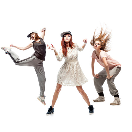 group of young female hip hop dancers isolated on white backgroundの写真素材