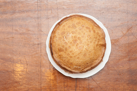 Delicious fried pancakes on old wooden table. Top view