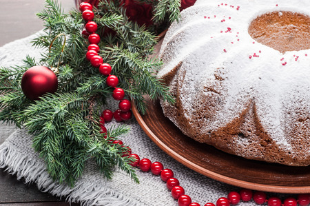 traditional decorated christmas cake on wooden tableの写真素材