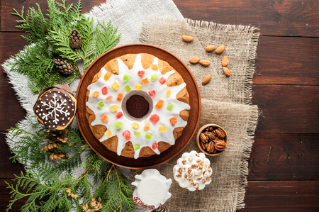 traditional decorated christmas cake on wooden tableの写真素材