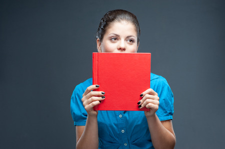 Smiling woman student, teacher or business lady holding books. Isolated studio portrait of business...